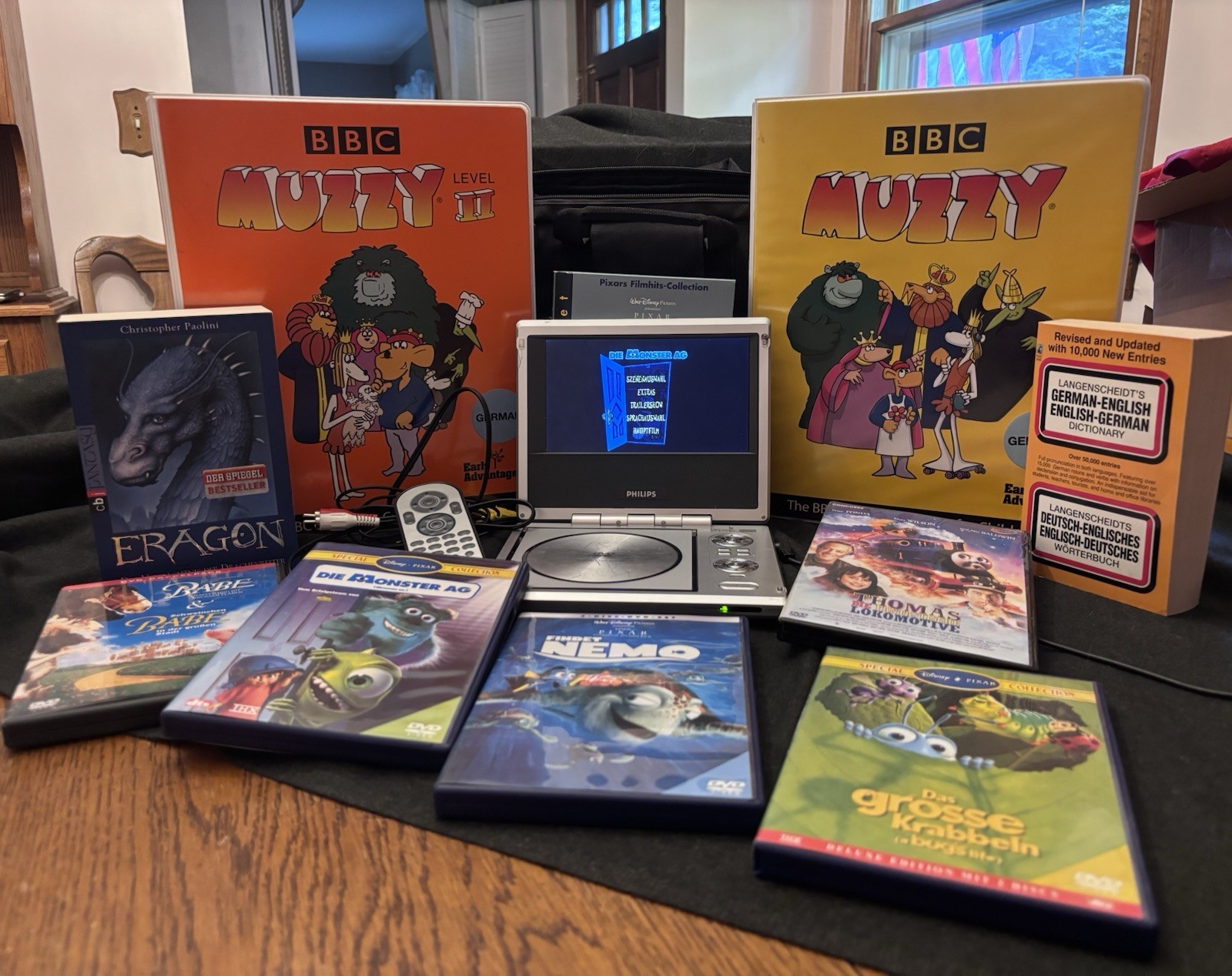Learn German Bundle Muzzy/Findet Nemo Monsters Inc/3DVDs/books/Small DVD Player
