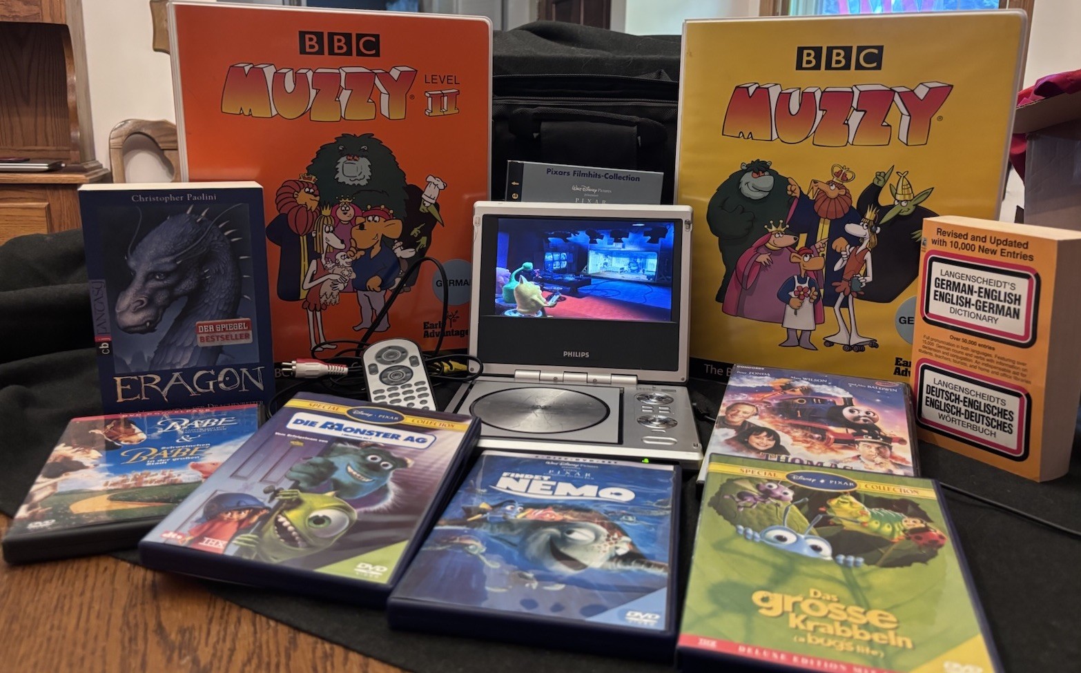 Learn German Bundle Muzzy/Findet Nemo Monsters Inc/3DVDs/books/Small DVD Player