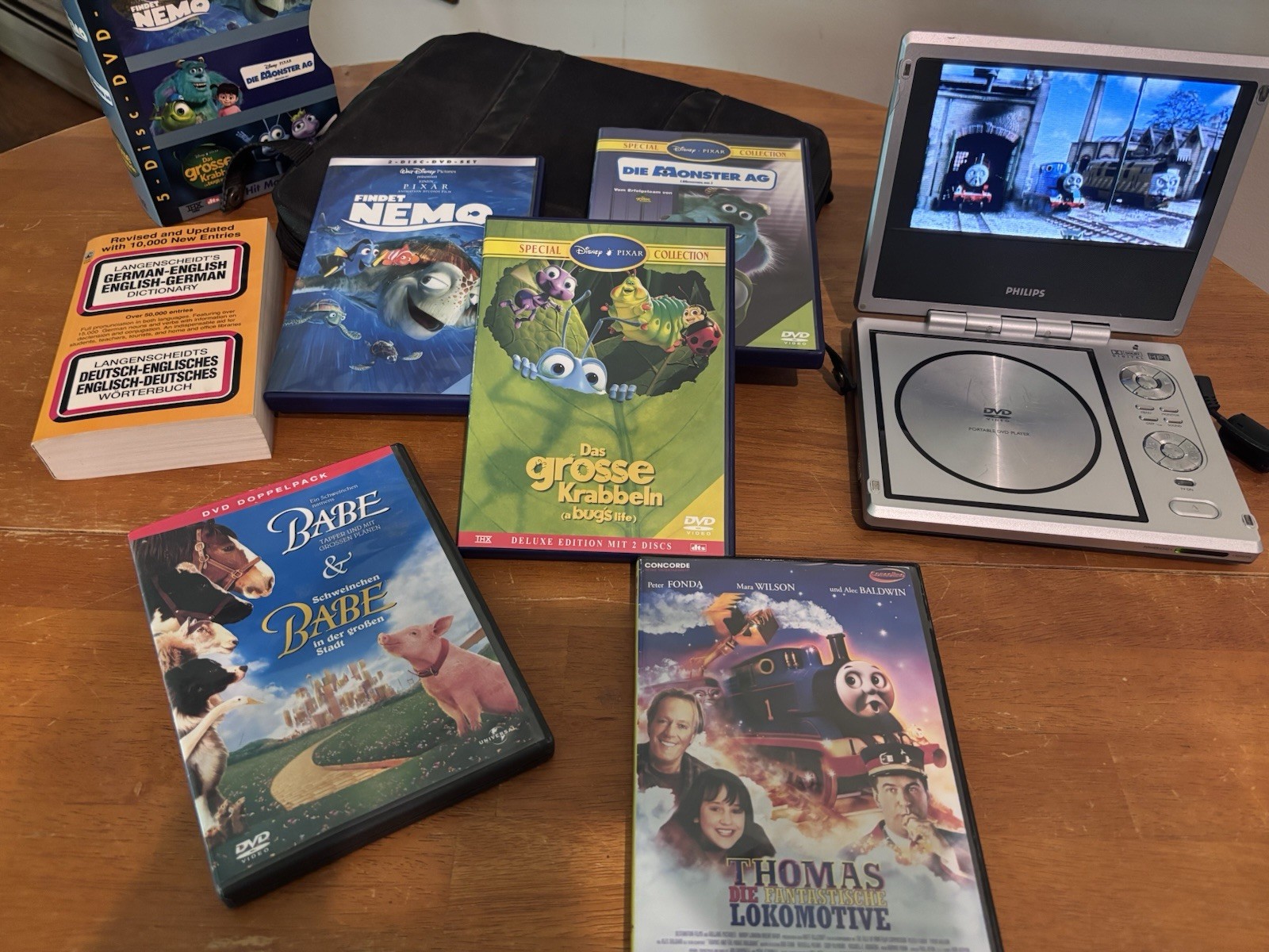 Learn German Bundle Muzzy/Findet Nemo Monsters Inc/3DVDs/books/Small DVD Player